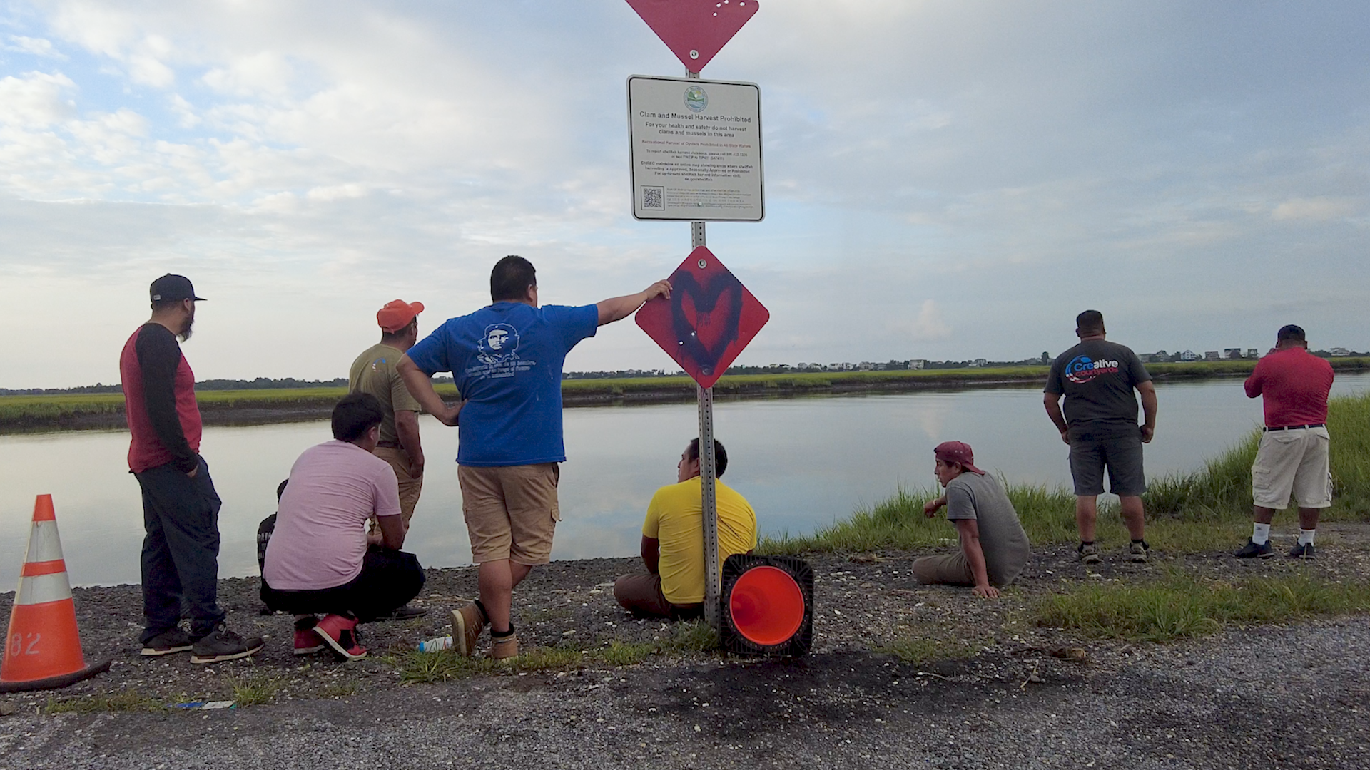 Family, friends and coworkers of 18-year-old Yorch Niz-Chilel looking over where he was last seen on the Broadkill River.